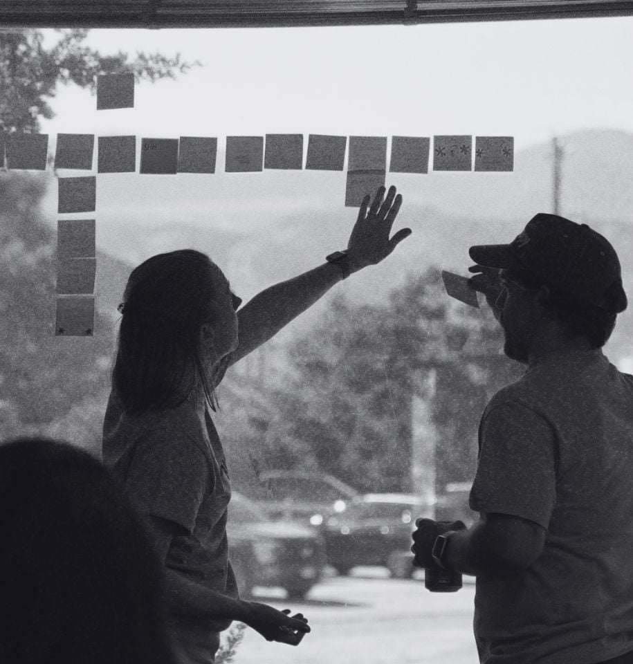 Builder Funnel team organizing sticky notes while planning a marketing workflow.